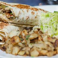 Chicken Shawerma · Sliced chicken breast marinated and grilled, served in lavash with creamy garlic and pickles...