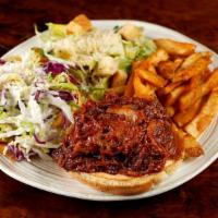 BBQ Pork Sandwich · Slow-roasted, served southern style with bbq sauce and coleslaw on a bun. Served with a caes...