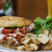 Mediterranean · Grilled eggplant, roasted peppers, tomatoes, pesto and provolone on a focaccia bun.