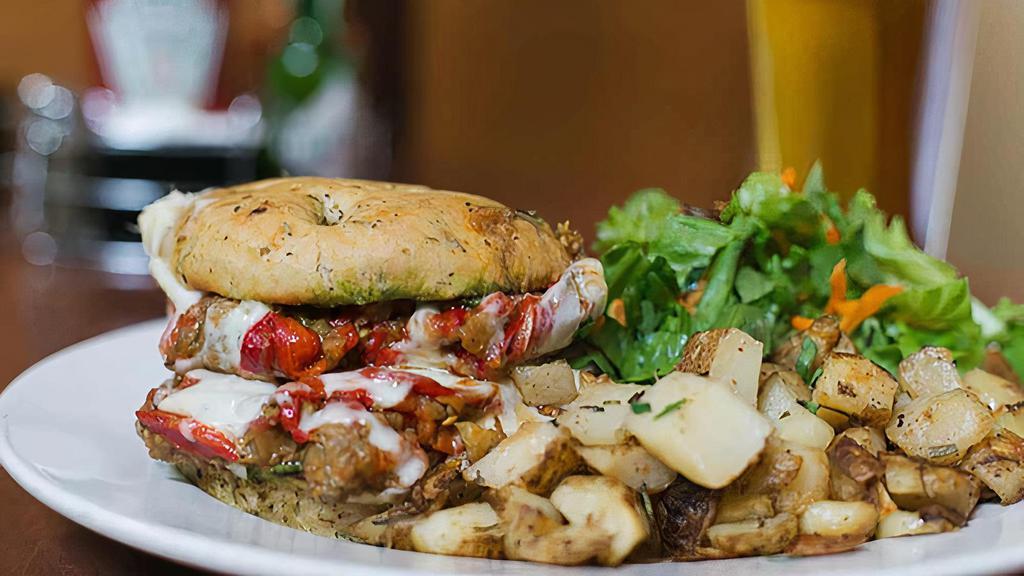 Mediterranean · Grilled eggplant, roasted peppers, tomatoes, pesto and provolone on a focaccia bun.