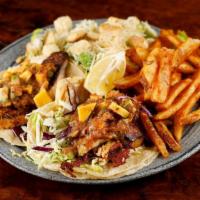 Fish Tacos · Grilled tilapia served on two corn tortillas topped with mildly spiced slaw with mango salsa...