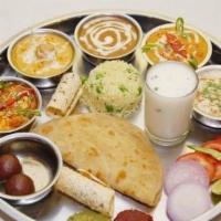 Punjabi Thali · 3 Vegetables, Rice, Daal, Roti/Puri, Sweet,  Farshan, Pickle & Raita