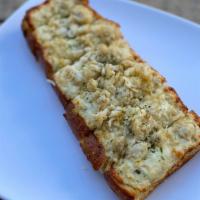 Cheesy Bread w/ Dungeness Crab · Slice of sourdough with our cheesy garlic sauce topped with  Dungeness crab meat toasted to ...