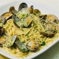 Clams Linguine · Littleneck Clams over Linguine pasta with garlic butter sauce with sprinkles of parmesan che...