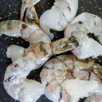 8-12 · Extra Colossal Raw Shrimp, cleaned and deveined tail-on. 2lb Bag