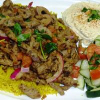 Lamb & Beef Shawarma Plate · Marinated thin slices of lamb, and beef, grilled with onions, and tomatoes.