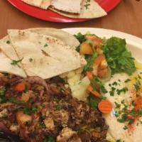 Ahmose Plate · Mixture of  lamb, beef, and chicken shawarmas grilled  with onion and tomatoes.
