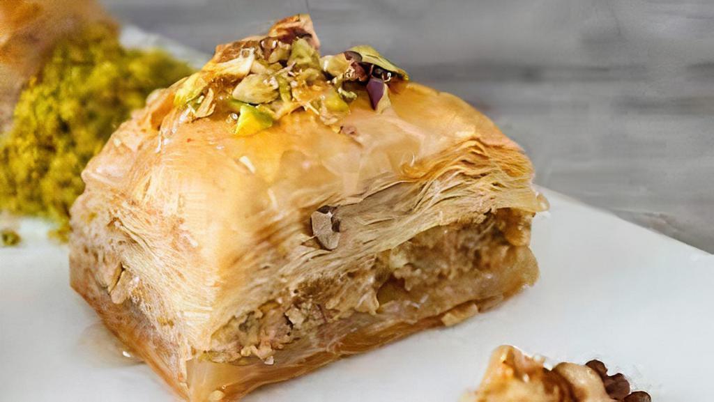 Walnut Baklava · Sweet crispy phyllo dough layers stuffed with walnuts topped with honey syrup.