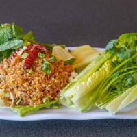 Crispy Rice Salad · Deep fried rice ball, pork sausage, lime juice, peanut, served with lettuce, mint and cilant...