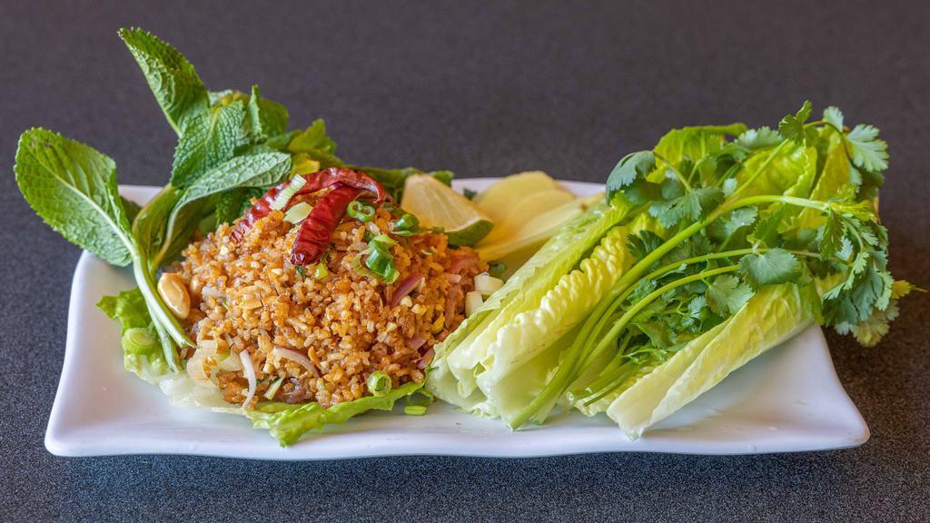 Crispy Rice Salad · Deep fried rice ball, pork sausage, lime juice, peanut, served with lettuce, mint and cilantro.