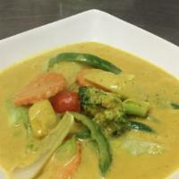 Yellow Curry · Yellow curry paste with coconut milk, potatoes, onions, carrot, choice of meat or fried tofu