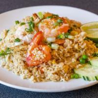 Thai Fried Rice · Stir-fried rice with egg, tomatoes, yellow onion, green onion, snow peas and carrot, and cho...
