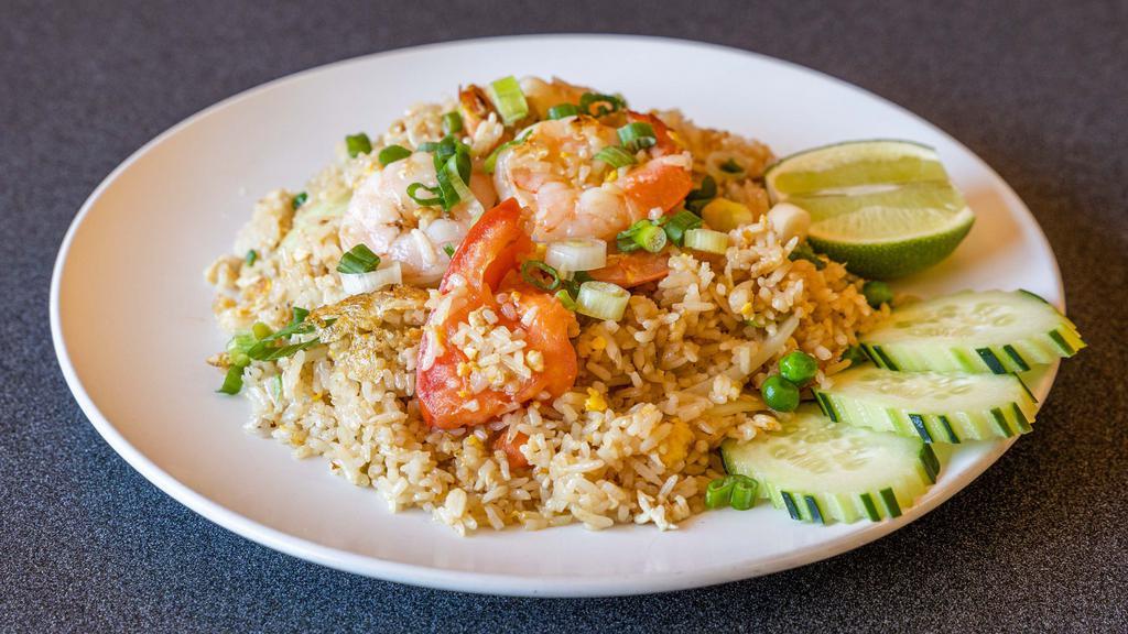 Thai Fried Rice · Stir-fried rice with egg, tomatoes, yellow onion, green onion, snow peas and carrot, and choice of protein. Served with cucumber and lime.