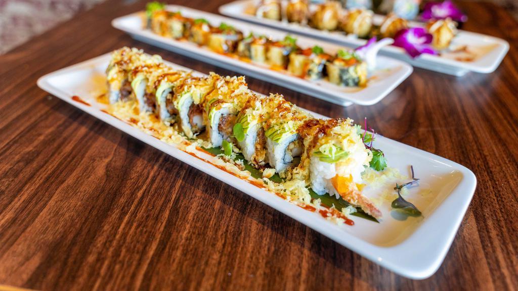 Fiesta Roll **1 · Salmon, cream cheese, jalapeno, deep fried, top with tobiko and house special sauce