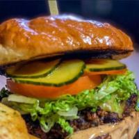 Smoky Black Bean Burger · Romaine, tomato, house B&B pickles, avocado, smoked gouda,  chipotle aioli.