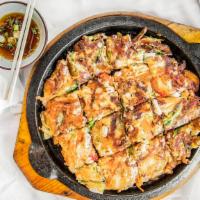 Seafood Pancake · Sizzling seafood pancake with mixture of shrimp, clamp, and squid with various vegetables.
