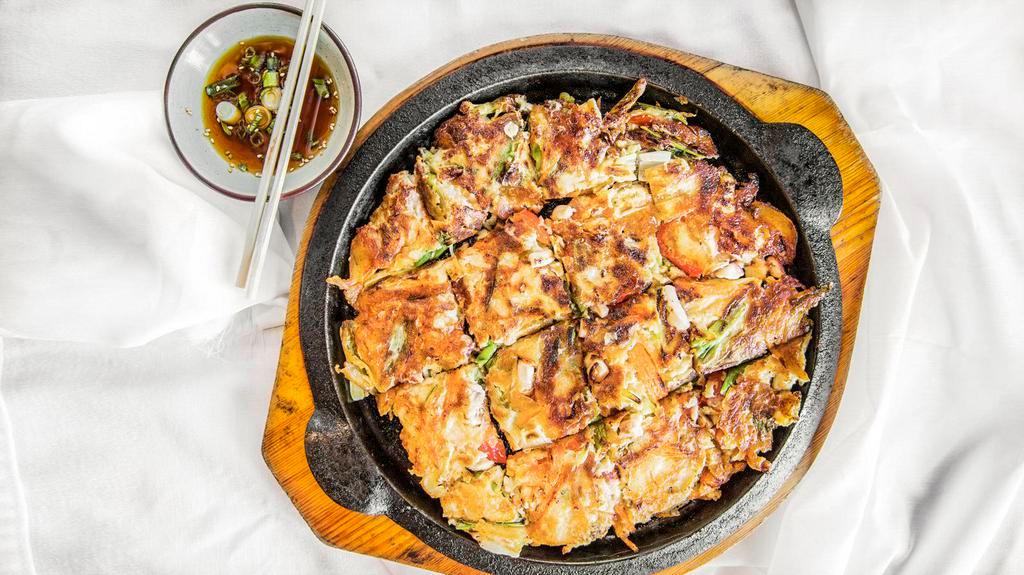 Seafood Pancake · Sizzling seafood pancake with mixture of shrimp, clamp, and squid with various vegetables.