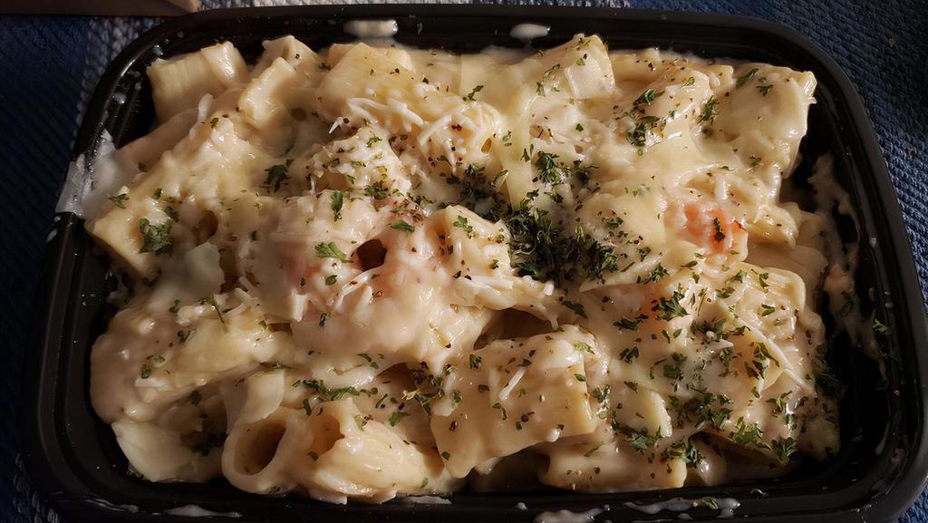 Pasta Alfredo · Penne pasta in our rich Alfredo sauce with shaved parmesean cheese and a side of garlic bread.

Also available with Chicken or Shrimp