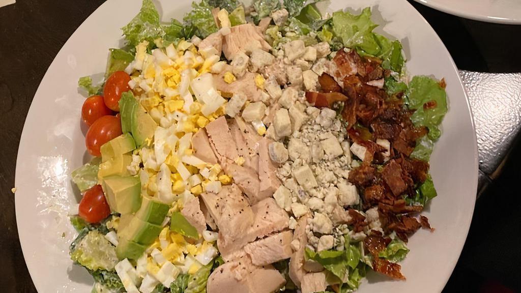Cobb Salad · Chopped lettuce, grilled chicken, bacon, cherrry tomatoes, avocado, egg, blue cheese crumbles served with choice of ranch or blue cheese dressing