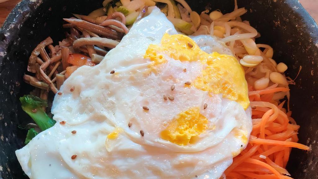 Seafood Stone Bi Bim Bob · Steamed rice & vegetables topped w/egg & spicy seafood
