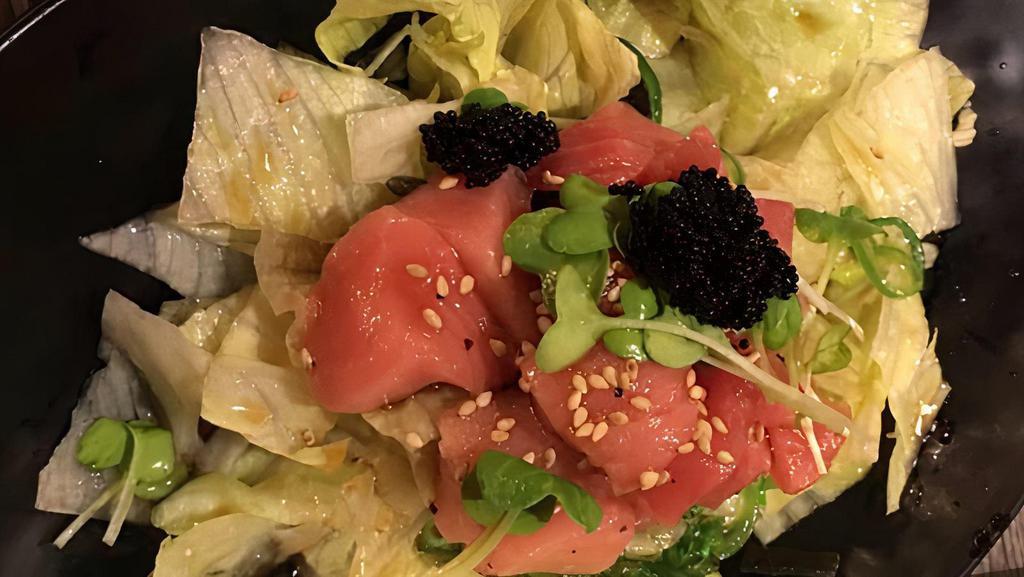 Poki Salad · Chopped tuna with green salad, seaweed salad, avocado, and cucumber.