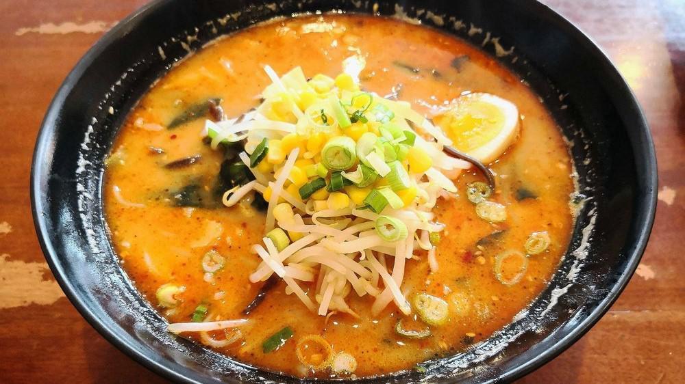 A3. Miso Ramen · 味噌拉面 Spicy or not spicy. Roast pork chicken egg (half an egg), cabbage, wakame (kelp), black fungus, corn, bean sprout, bamboo shoots, green onion.
