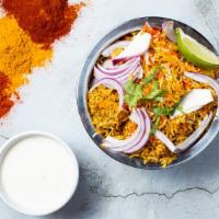 Rad Vegetable Biryani · Spiced seasoned vegetables cooked with Indian spices and basmati rice. Served with house rai...