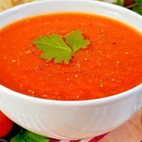 Tomato Roasted Garlic soup · Roasted garlic with tomato soup served piping hot.