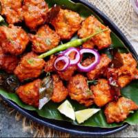 Chicken 65 · Deep fried boneless chicken pieces marinated with spices. Believed to be originated from Che...