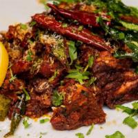 Mutton Sukka Gravy · Cooked with a melange of southern spices and Goat meat