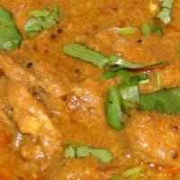 Goat korma · Goat cook with coconut spiced gravy