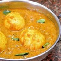 Chettinaad Egg Curry (Muttai Kulzhambu) · Authentic Tamil flavors with poached egg tossed with tangy sauce of tamarind, onion, coconut...