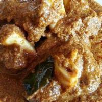 Goat Vindaloo · Goat cook with mid spiced onion tomato gravy and potato
