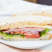 Ham & Swiss Sandwich · 520 cal. Ham, Swiss cheese, lettuce, tomato, red onion, dijon on sliced sourdough rye.