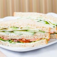 Vegetarian Sandwich · 590 cal. Jack cheese, cucumber, lettuce, tomato, avocado, dill sauce on three slices of 9-­g...