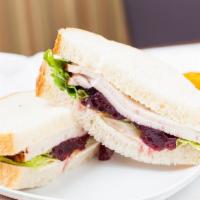 Turkey Cranberry Sandwich · 470 cal. turkey, cranberry sauce, lettuce, mayo on sliced sourdough.