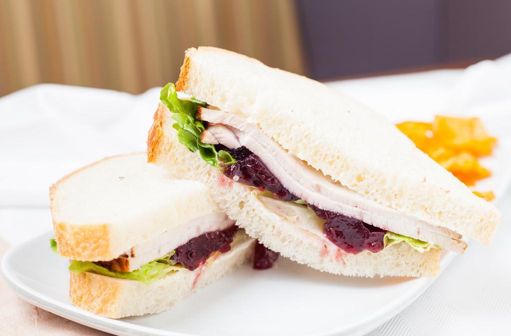 Turkey Cranberry Sandwich · 470 cal. turkey, cranberry sauce, lettuce, mayo on sliced sourdough.