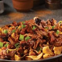 Brisket Chili Frito Pie Stack · A classic combination of Fritos topped with our Brisket Chili, shredded cheddar cheese, and ...