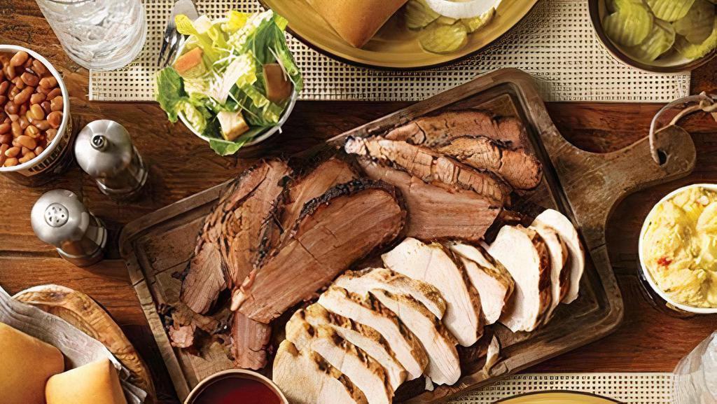 Family Pack · Includes a choice of 2 meats ( 1 lb. each), 3 medium sides, 6 rolls and barbecue sauce