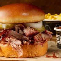 Pulled Pork Sandwich Plate. · Our delicious smoked pork on a brioche bun, served with 2 sides.