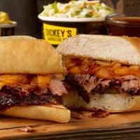 Pit Dip Sandwich Plate · Sliced brisket, pit-smoked caramelized onions, & cheddar cheese on a toasted hoagie bun. Ser...