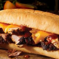 Westerner Sandwich · Texas sized sandwich, with your choice of two slow-smoked meats and cheddar cheese on a toas...