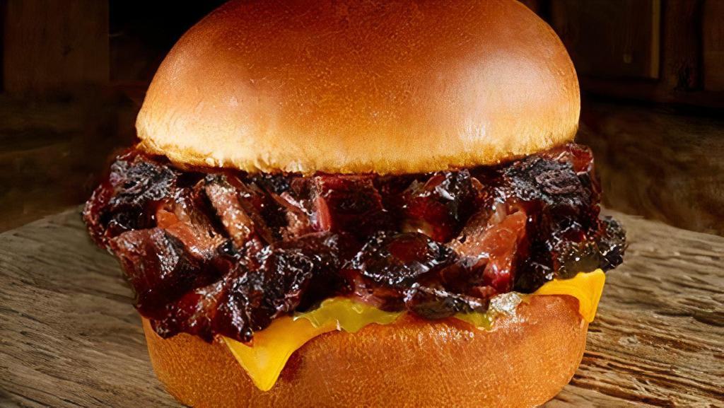 Brisket Burnt Ends Sandwich · Chopped burnt ends of brisket with cheese & pickles, served on at toasted brioche bun.
