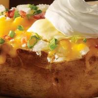 Loaded Giant Baker · A big ole spud filled with your favorite toppings of bacon, cheddar, onions, margarine and s...