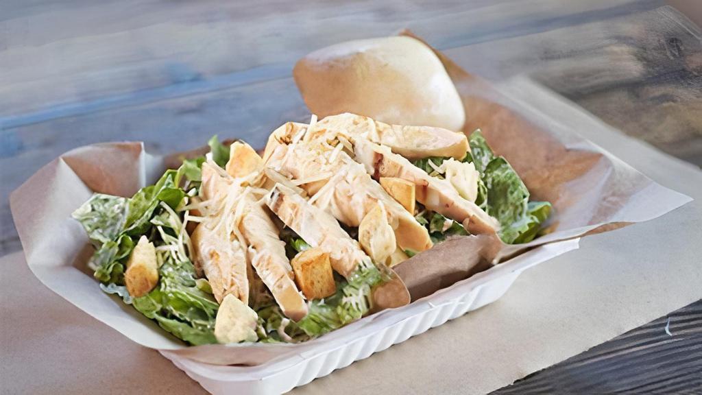 Chicken Caesar Salad · Crisp romaine lettuce, parmesan cheese and crisp croutons top with Marinated smoke chicken.  Includes a warm yeast roll
