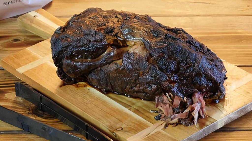 Pork Butt/Shoulder Whole · A whole pork butt dry rubbed with our secret rib rub spices slow then slow smoked for 12 hours in our hickory wood pit. Feeds 12-15 folks.
