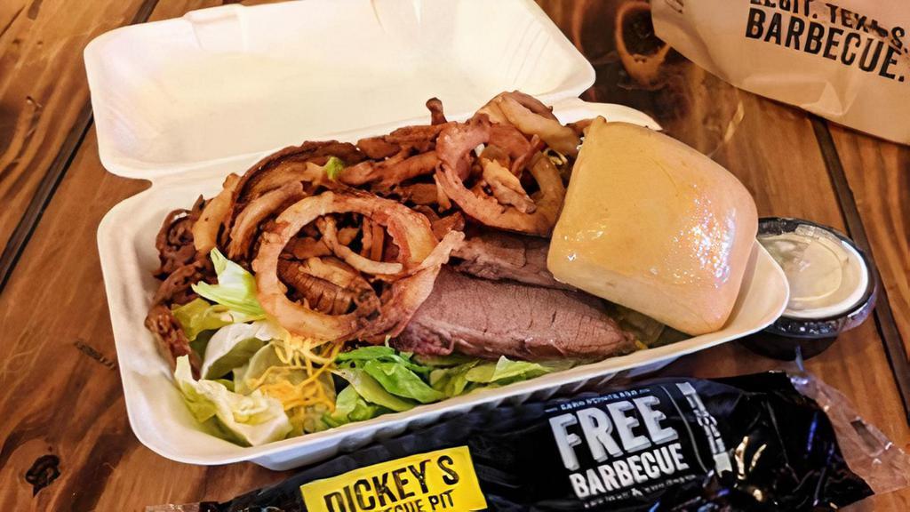 Smokehouse Salad · Chopped Brisket, cheddar cheese, crisp fried onion tanglers over a bed of crisp romaine lettuce.  Served with ranch dressing and a warm yeast roll