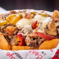 Monster Cheesesteak · Half pound (1/2lb) Ribeye, Cheese, Grilled Onions, Mushrooms, Sweet Peppers, Hot Peppers, Ba...