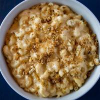 Classic Mac & Cheese Party-Sized · Rich cheddar cheese sauce, touch of cream, parmesan cheese and elbow pasta with baked garlic...