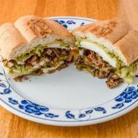 Torta · Choice of meat, lettuce, onions, guacamole, and jalapeños.